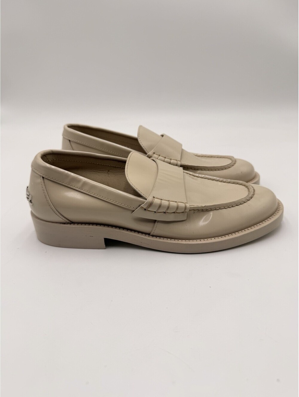 Women’s Chanel Shiny Calfskin Logo Loafers in beige Size 35
